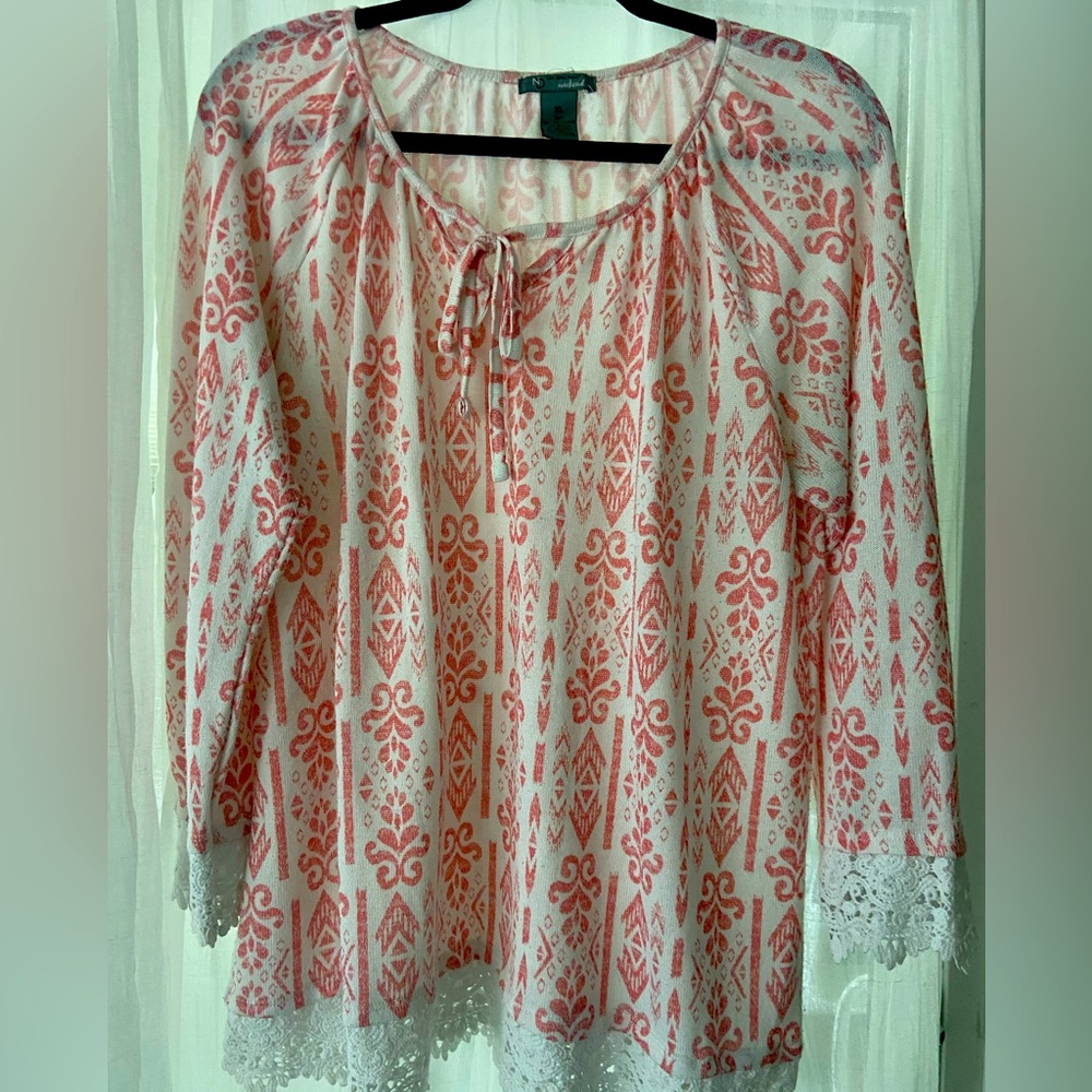 Lightweight knit type top with crochet trim.  Tie at neck.  Super cute